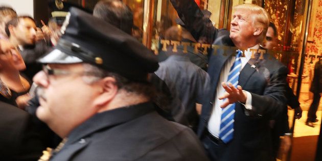 Donald Trump greets supporters outside of Trump Towers in Manhattan October 8, 2016 in New York City.