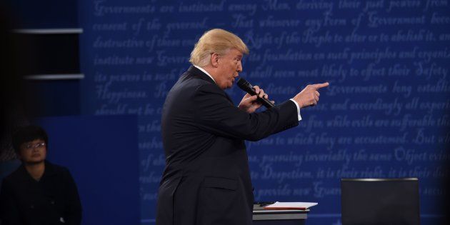 US Republican presidential candidate Donald Trump debates during the second presidential debate at Washington University in St. Louis, Missouri, on October 9, 2016. / AFP / Robyn Beck (Photo credit should read ROBYN BECK/AFP/Getty Images)