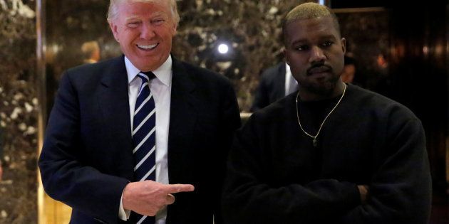 U.S. President-elect Donald Trump and musician Kanye West pose for media at Trump Tower in Manhattan, New York City, U.S., December 13, 2016. REUTERS/Andrew Kelly TPX IMAGES OF THE DAY
