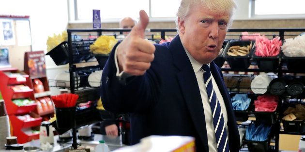 Republican presidential nominee Donald Trump gives a thumbs up to a reporter while stopping for snack food at a Wawa gas station November 1, 2016 in Valley Forge, Pennsylvania.
