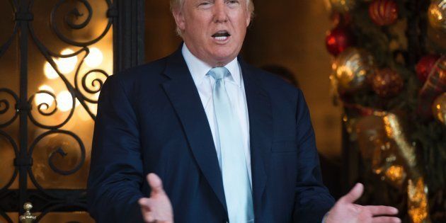 US President-elect Donald Trump answers questions from the media after a day of meetings on December 28, 2016 at Mar-a-Lago in Palm Beach, Florida. / AFP / DON EMMERT (Photo credit should read DON EMMERT/AFP/Getty Images)