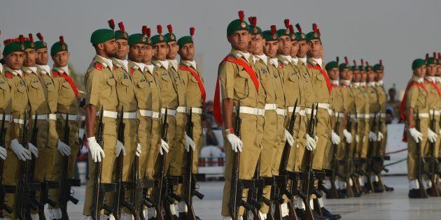 Pakistani military cadets march on the birth anniversary of the country's founder Mohammad Ali Jinnah at his mausoleum in Karachi on December 25, 2016.
