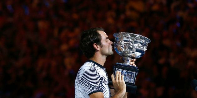 Melbourne Park, Melbourne, Australia - 1/29/17 - Switzerland's Roger Federer celebrates winning his Men's singles final match against Spain's Rafael Nadal. (REUTERS/David Gray)
