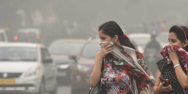 NEW DELHI, INDIA - NOVEMBER 6: People protect themselves after pollution reached hazardous levels at Janpat Road, on November 6, 2016 in New Delhi, India. New Delhi's air quality has steadily worsened over the years, a consequence of rapid urbanisation that brings pollution from diesel engines, coal-fired power plants and industrial emissions. The air quality continued to remain alarming in Delhi-NCR because of calm winds. People living in Delhi-NCR complained about respiratory problems and itching in the eyes due to smog all over the region. (Photo by Arun Sharma/Hindustan Times via Getty Images)