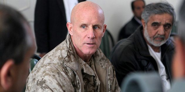 Vice Adm. Robert S. Harward, commanding officer of Combined Joint Interagency Task Force 435, speaks to an Afghan official during his visit to Zaranj, Afghanistan, in this January 6, 2011 handout photo. The visit consisted of a tour of a provincial prison, the Iran/Afghanistan border crossing and an airfield assessment. Sgt. Shawn Coolman/U.S. Marines/Handout via REUTERS ATTENTION EDITORS - THIS IMAGE WAS PROVIDED BY A THIRD PARTY. EDITORIAL USE ONLY