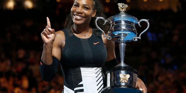 Tennis - Australian Open - Melbourne Park, Melbourne, Australia - 28/1/17 Serena Williams of the U.S. gestures while holding her trophy after winning her Women's singles final match against Venus Williams of the U.S. .REUTERS/Issei Kato TPX IMAGES OF THE DAY