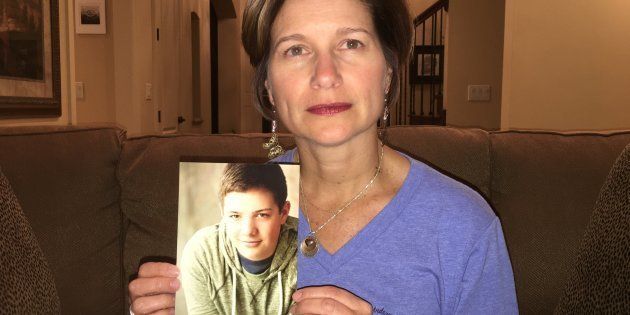 Mindy Corporon holds a photo of her son, Reat Griffin Underwood, who, along with her father, was killed in a 2014 shooting at the Jewish Community Center of Greater Kansas City.