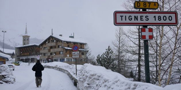 A road sign is seen on the side of a mountain road after a snow fall in Tignes on January 15 this year