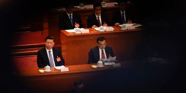 Xi Jinping and Li Keqiang attend the National People's Congress. March 8.