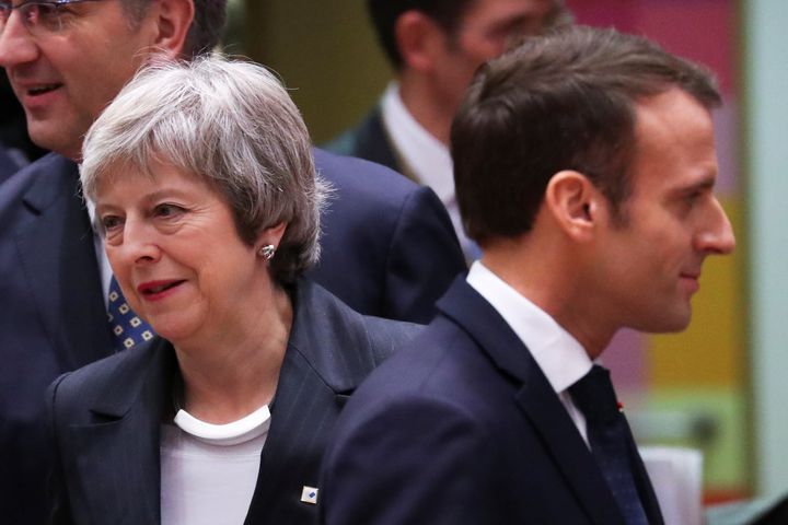 Britain's Prime Minister Theresa May and French President Emmanuel Macron take part in a European Union leaders summit in Brussels
