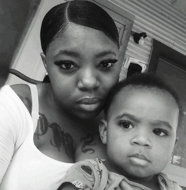 Delashon holding her son, Rayray.