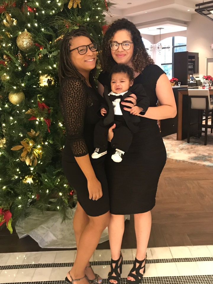 The author (right) with her wife, Tiffany, celebrating their son Orion's first holiday season (2018).