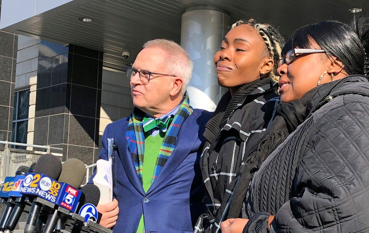 Jazmine Headley, center, was reunited with her 1-year-old son after he was forcibly taken from her arms while waiting at a social services office.