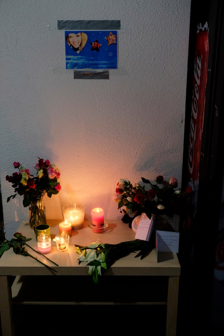 Tributes are placed on a table in an apartment block in Rotterdam, Netherlands, on Friday Dec. 14, 2018, where American stude