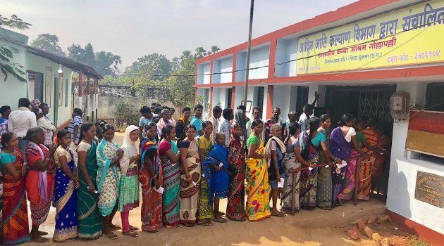 Voters line up to vote at a polling station in Sukma in Chhattisgarh state on 12 November.
