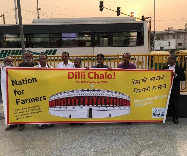 Artistes with banners saying 'Dilli Chalo'