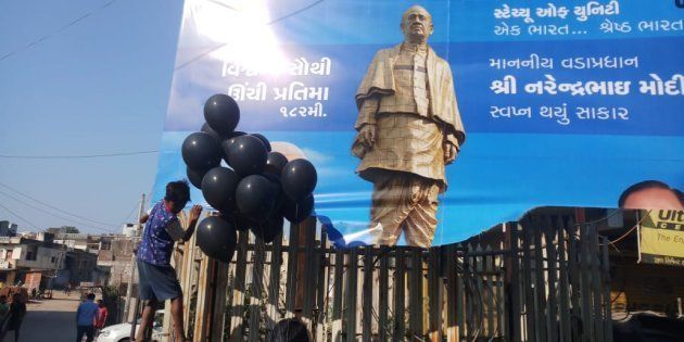 Demonstrators release black balloons to protest inauguration of Sardar Patel Unity Statue in Gujarat.