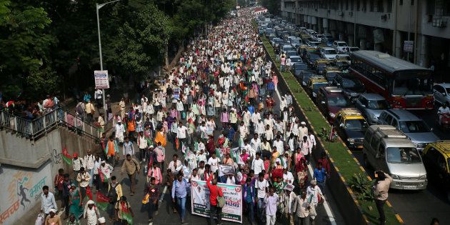 Farmers march in Mumbai demanding loan waivers and the transfer of forest lands to villagers.