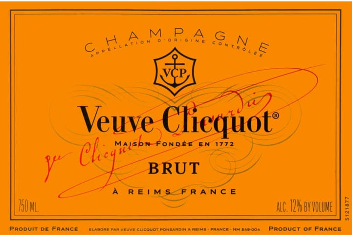 This Veuve Clicquot Champagne label doesn't display a year, meaning it's non-vintage and is made with a blend of different vintages. It's also labeled "brut," which means it contains 0-12 grams of sugar per liter.