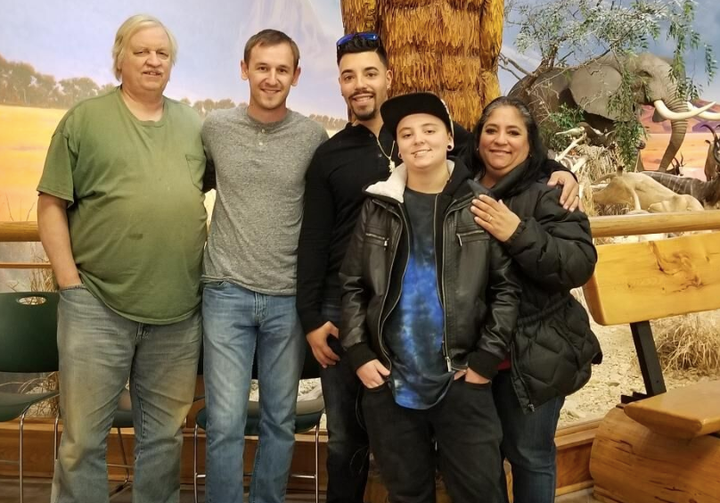 Michael Critchfield (second from right) with his mother Caroline (far right), his father Jon (far left) and his two brothers Daniel and William (center).