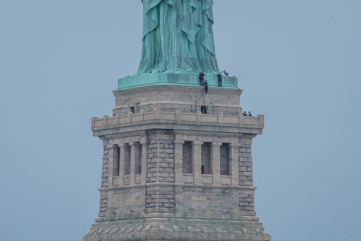 New York City's Liberty Island was evacuated after Okoumu climbed up onto the Statue of Liberty's base on the Fourth of July to protest the Trump Administration’s immigration policy.