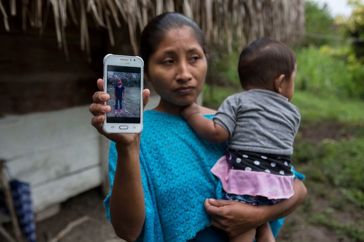 Claudia Maquin, 27, shows a photo of her daughter Jakelin Caal in Raxruha, Guatemala, on Dec. 15. The 7-year-old girl died in a Texas hospital on Dec. 8, two days after being taken into custody by Border Patrol agents in a remote stretch of New Mexico desert. 