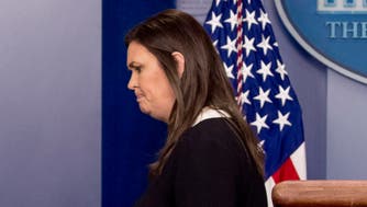 White House press secretary Sarah Huckabee Sanders ends the daily press briefing at the White House, Tuesday, Dec. 18, 2018, in Washington. Sanders discussed the delayed sentencing for former national security adviser Michael Flynn and other topics. (AP Photo/Andrew Harnik)
