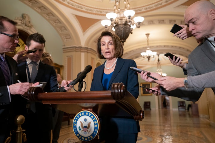 House Democratic Leader Nancy Pelosi (Calif.), the speaker-designate for the new Congress in January, talks to reporters on Tuesday.