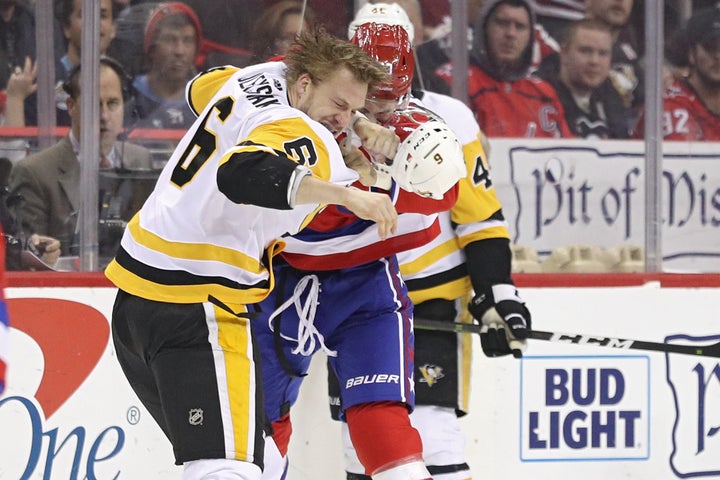 Tom Wilson of Washington fights Jamie Oleksiak of Pittsburgh in an NHL game on Wednesday.