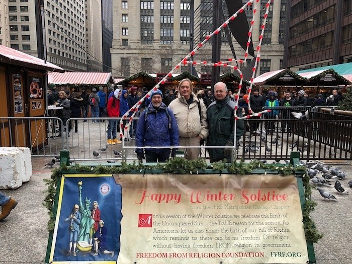 A Freedom From Religion Foundation banner was placed at Chicago's Daley Plaza this year. The display counters a Christian creche and a Jewish menorah at the same location, according to the FFRF.