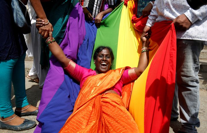 An activist of the lGBT community celebrates after the Supreme Court's verdict of decriminalizing gay sex and revocation of the Section 377 law, in Bengaluru, India, on 6 September 2018.