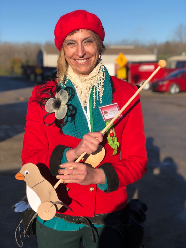 Holding the toy duck I made at Santa school.