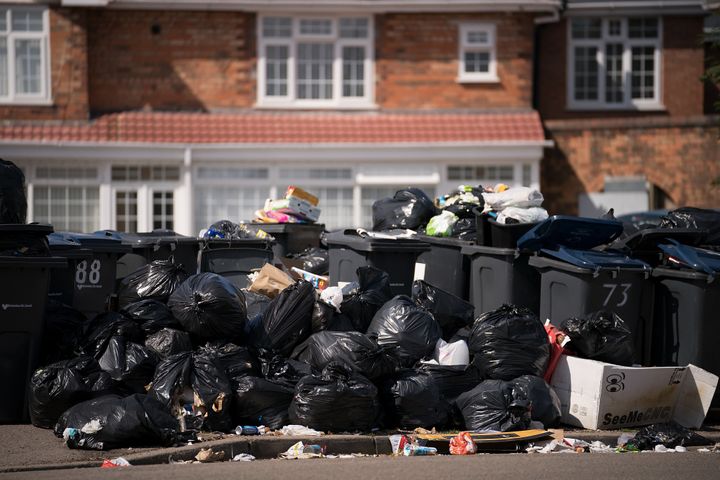 Rubbish piled high on a suburban Birmingham street during 222 days of strike action by the city's binmen last year