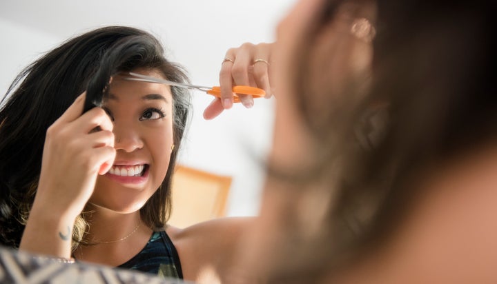 No matter how you feel about bangs, growing them out sucks.