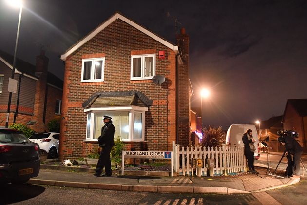 Officers outside the house in Auckland Close