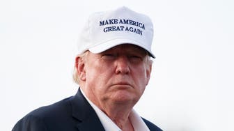 President Donald Trump looks to the media as he walks from Marine One to board Air Force One at Morristown Municipal Airport, in Morristown, N.J., Sunday, July 29, 2018, en route to Washington after visiting Trump National Golf Club in Bedminster, N.J. (AP Photo/Carolyn Kaster)