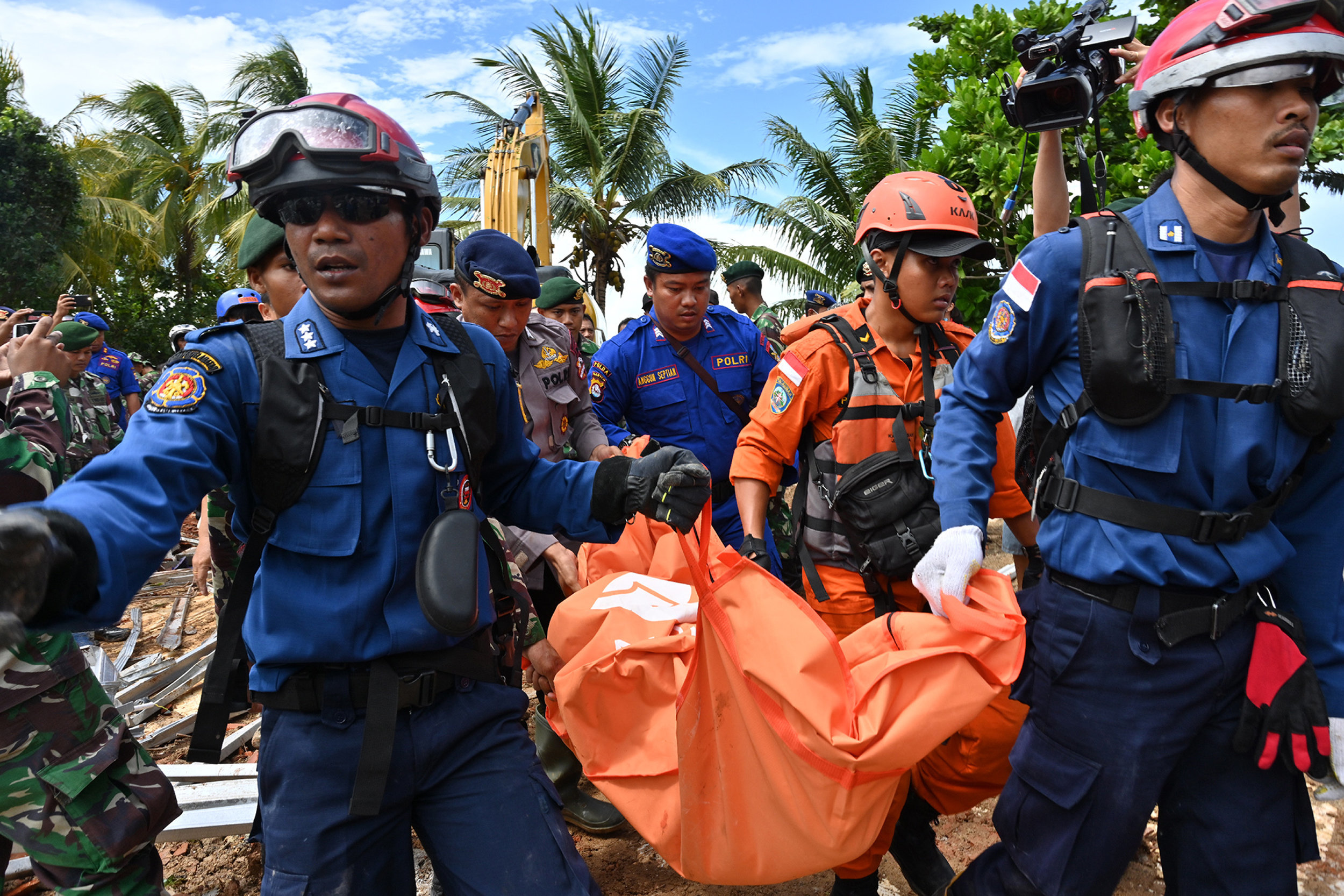 Rescuers Dig Through Rubble For Survivors After Indonesian Tsunami ...