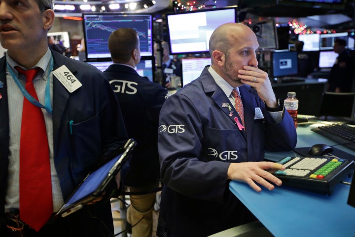 Traders work on the floor of the New York Stock Exchange in New York, Monday, Dec. 24, 2018. (AP Photo/Seth Wenig)
