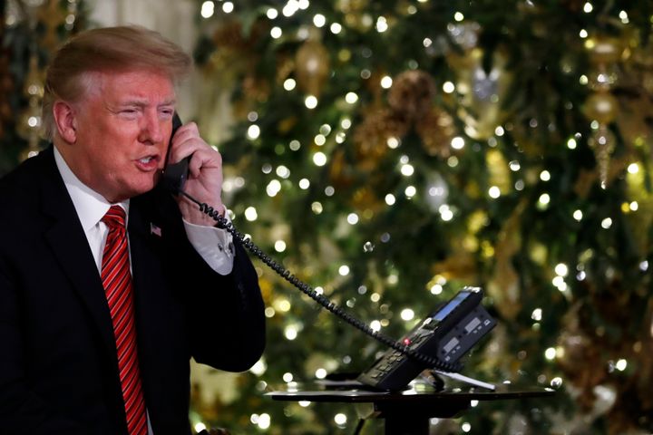 President Donald Trump speaks on the phone sharing updates to track Santa's movements from the North American Aerospace Defense Command (NORAD) Santa Tracker on Christmas Eve, Monday, Dec