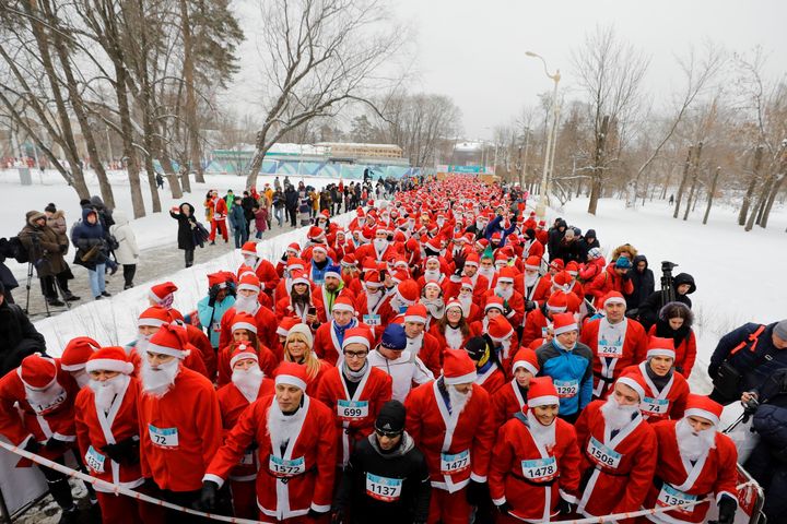 People dressed as Father Frost, the Russian equivalent of Santa Claus, participate in the race 'HappyRun' at the VDNH exhibition center in Moscow, Russia.