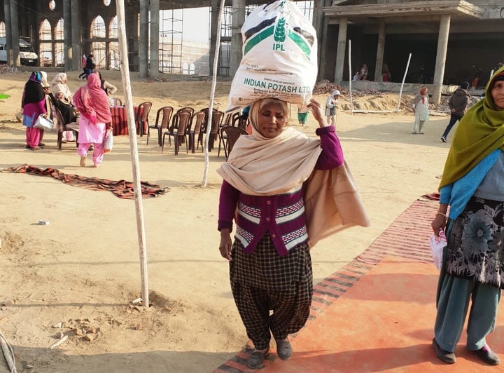 On the Christmas eve, 68-years-old Kartari Devi collecting ration from a private church in Jalandhar district of Punjab.