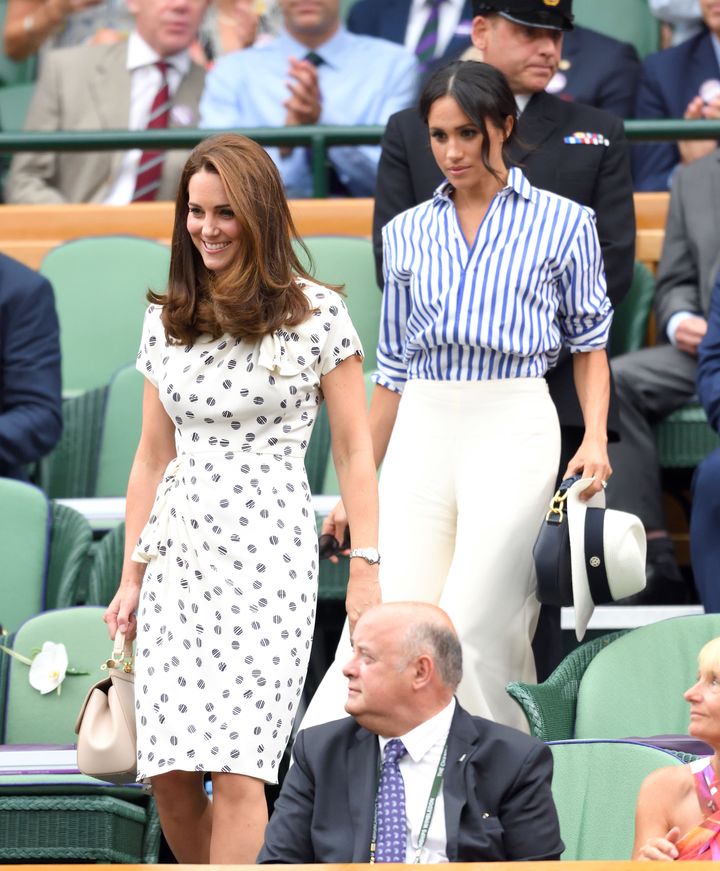 Catherine, Duchess of Cambridge, and Meghan, Duchess of Sussex, attend the Wimbledon Tennis Championships on July 14 in London.