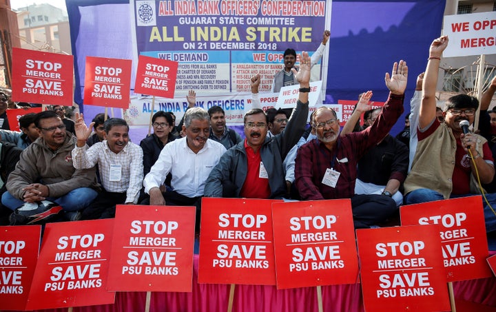 State-run bank employees shout slogans and carry placards during a day-long nationwide strike, in Ahmedabad, December 21, 2018.