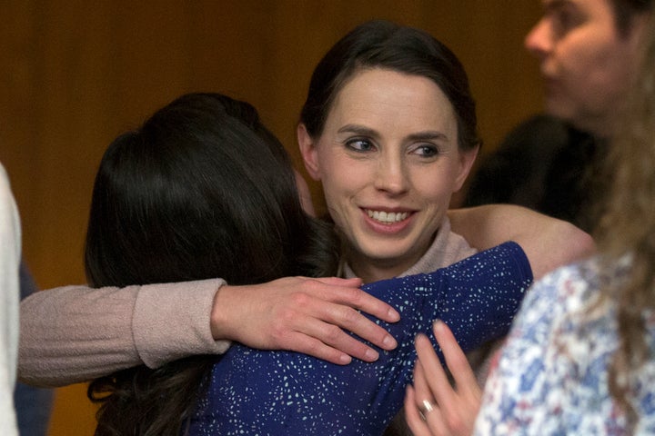 Rachael Denhollander hugs Larissa Boyce at the conclusion of Larry Nassar's sentencing.