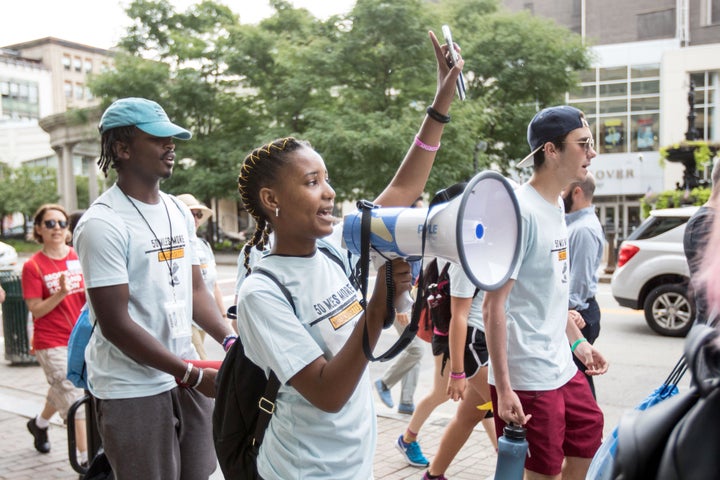 Participants in the 50 Miles More walk against gun violence head for Smith & Wesson’s headquarters in Springfield,