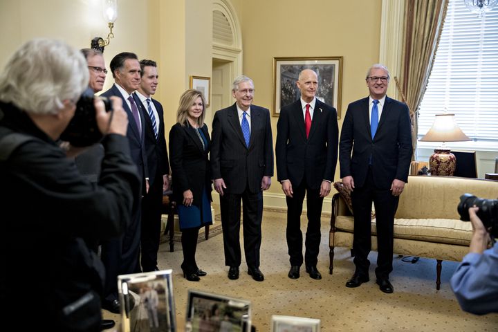 Senate Majority Leader Mitch McConnell, posing with newly elected Republican senators, will have a trickier job leading his caucus in 2019.