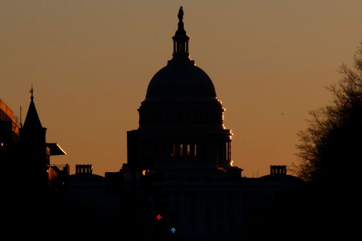 The U.S. Capitol Dome is seen in silhouette as the sun rises in Washington, Sunday, Dec. 23, 2018. (AP Photo/Carolyn Kaster)