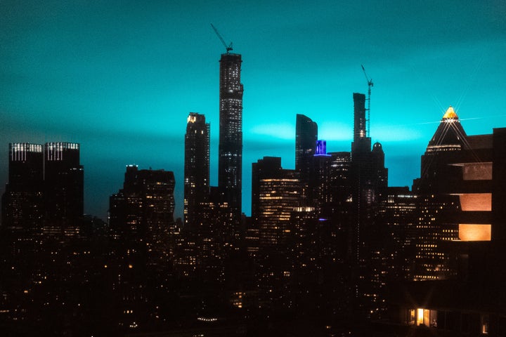 The eerily bright blue glow of an electrical accident in Astoria, Queens illuminated the New York City skyline late Thursday night.