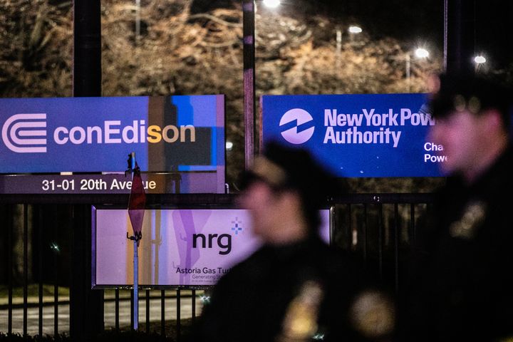 New York Police Department officers stand outside a Consolidated Edison plant in Astoria on Thursday night. 