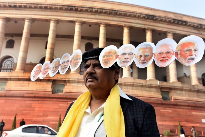 TDP MP Naramalli Sivaprasad, dressed up like Ravana, stages a protest outside Parliament House demanding special status for Andhra Pradesh.